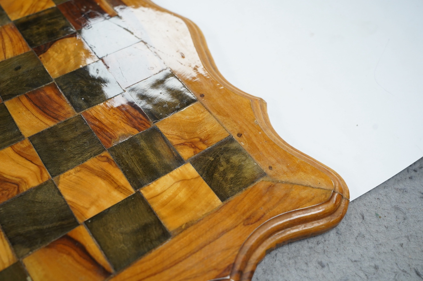 A 19th century stained and natural bone chess set with board, 34cm x 34cm. Condition - fair, some damage to some chess pieces